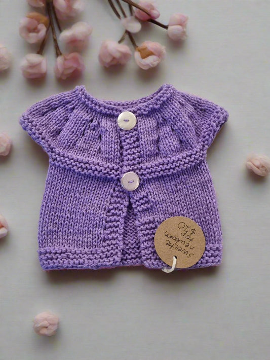 Amanda Knits - Sweetie capped cardi. Newborn size. 75% merino wool. 25% Nylon.